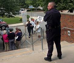 Protesters target Brazilian house cleaners at library lecture