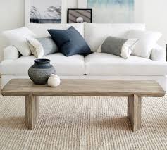 The top of the coffee table is built of salvaged wood from reclaimed shipping pallets milled into individual tongue. Pismo 65 Reclaimed Wood Coffee Table Pottery Barn