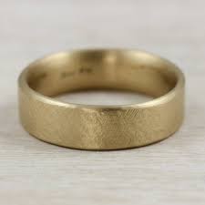 This Hand Carved Flat Edgeless Band Is Slightly Flat On The Outside With A Rustic Textur Mens Gold Wedding Band Brushed Gold Wedding Band Colored Wedding Rings