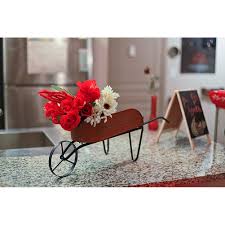 Have a look at the antique, vintage, and modern wheeled carts and wheelbarrows that have been given a new life as a flower planter. Oxidized Finish Metal Decorative Country Farmhouse Wheelbarrow Planter 9 25 X 27 X 8 Inches Overstock 28328341