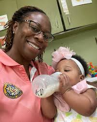 5 month old Kensley holding her bottle! So precious!