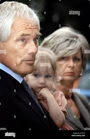 Candidate for the UK Independence Party, Robert Kilroy Silk leaves a  polling Station in Little Chalfont, Buckinghamshire with his grand daughter  Seraphina and his wife Jan after voting in the local and