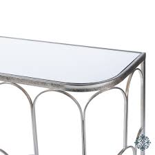 Scalloped edges on the apron add a touch of elegance. Odessa Mirrored Console Silver Leaf