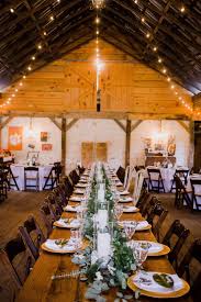 The Twinkling Bistro Lights Perfectly Accentuate The Dramatic Barn Ceilings An Elega North Georgia Wedding North Georgia Wedding Venues Georgia Wedding Venues