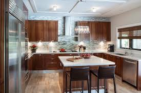 Rated 5 out of 5 stars. Contemporary Kitchen With Gray Mosaic Tile Backsplash And Cherry Wood Cabinets Hgtv