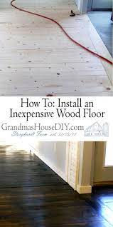 Inexpensive Wood Floor That Looks Like A Million Dollars How To Do It Yourself Cheap Flooring Diy Wood Floors Diy Hardwood Floors