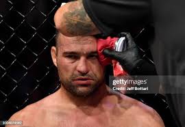 Justin Ledet punches Aleksandar Rakic of Austria in their light... News  Photo