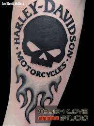 The placement, the size and the coloring of this biker tattoo design is almost perfect. 52 Awesome Harley Tattoos