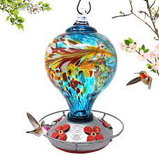 Check out our hummingbird feeder selection for the very best in unique or custom, handmade pieces from our feeders & birdhouses shops. Amazon Com Grateful Gnome Hummingbird Feeder Hand Blown Glass Large Blue Egg With Flowers 36 Fluid Ounces Free Bonus Accessories S Hook Ant Moat Brush And Hemp Rope Included Garden Outdoor