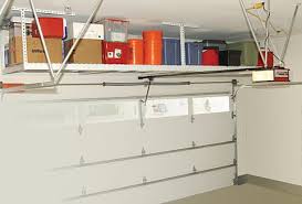 You can store a lot of. Garage Storage Right Over The Doors Garage Ceiling Storage Garage Shelving Diy Garage Storage