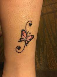 Feminine Butterfly Tattoo By The Ankle With Swirls And Hearts The Butterfly Tattoos For Women Tattoos For Women Butterfly Tattoo