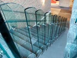 Finished with a modern glass balustrade, the wooden steps to have the illusion of floating. Stainless Steel Railing 33705 Couturier Iron Craft Glass Panel Indoor For Stairs