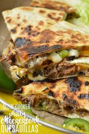 Place the chicken into the slow cooker, and pour over the chicken broth. Crock Pot Philly Cheesesteak Quesadillas Sugar Dish Me