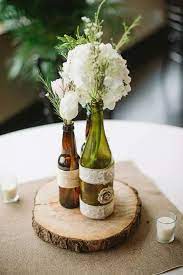 Diy Centerpieces With Beer Wine Bottles And Mason Jars Burlap Squares Beer Bottle Centerpieces Beer Centerpieces Bottle Centerpieces
