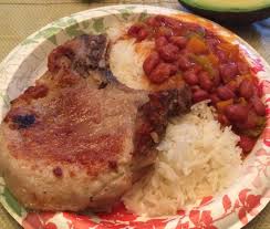 Divide among four individual plates, sprinkle with the chopped cilantro leaves, and serve with yellow rice. Arroz Y Habichuelas Rojas Con Chuleta De Cerdo Rice And Red Beans With Fried Pork Chop Latin Cuisine Easy Dinner Cooking Recipes