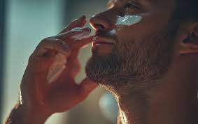Man applying aftershave balm to soothe freshly shaved skin | Premium  AI-generated image