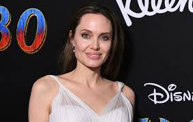 To celebrate world bee day, the actress posed for a portrait for national geographic while her body was swarmed in bees. Angelina Jolie Named Godmother Of Bees In New Humanitarian Venture