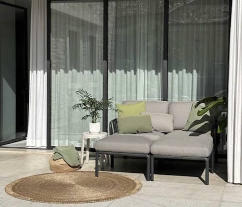 Apartment balcony in Mauritius refreshed with compact new outdoor furniture