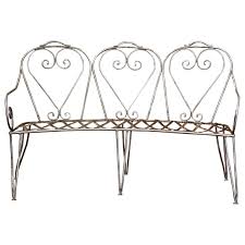 Item features (2) side chairs, maple leaf backs, round perforated mesh seats, wrought iron. 19th Century French Curved Polished Iron Three Seat Garden Bench From Normandy Country French Interiors