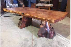 Turquoise was then laid into the wood's natural fissures. Live Edge Mesquite Dining Table With Turquoise Inlay Hat Creek Interiors