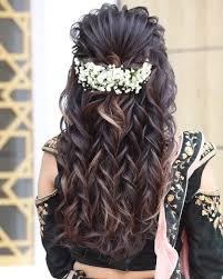 Dress up curled locks by pulling them all to one side and accessorizing with a statement pin or comb. Indian Wedding Hairstyles For Long Hair K4 Fashion