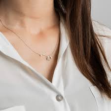 The striking zodiac pendant boasts a unique, graphic design offset by a sleek and feminine chain. Sagittarius Zodiac Constellation Necklace 18k White Gold Diamond Genevieve Collection Wolf Badger