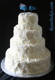 A sophisticated flavor combination, perfect for valentine's day or any day. Ivory Buttercream Roses Wedding Cake With Lovebirds Cake Topper