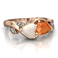 Fire opal has a bright glowing orange.warm 14 karat rose gold glows with an inner pink hue which flatters skin tones. Opal And Fire Opal Floral Elegance Ring R5790 Ropfr
