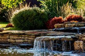 The rock waterfall makes a pleasing sound as it oxygenates the water. 10 Ways To Decorate Your Pond Water Garden Advice
