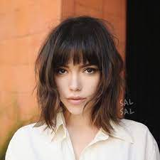 12 short hairstyles for women and girls with bangs in 2020: This Haircut Has French Girl Hair Written All Over It Wispy Textured And Just A Little Tousled Medium Short Hair Short Hair With Bangs Short Hair Styles