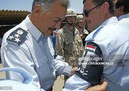 Iraqi Police Chief Riyadh Abbas places the Iraqi Police band