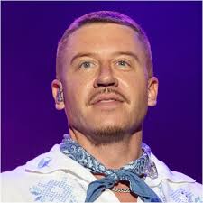 Rapper Macklemore said "F*** America" during a weekend concert. Scumbag  move. OutKick's David Hookstead puts him