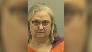 Employee of murdered former Wayne County mayor arrested, charged with  embezzlement