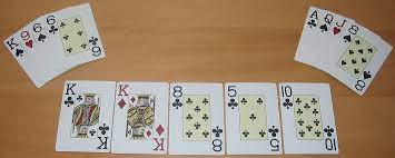 You collect cards from packs to fill up a board of cards until the board is full. Omaha Hold Em Wikipedia