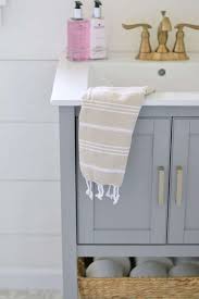 An easy and affordable way to invigorate your bathroom's interior design is by painting the walls and cabinets. How To Decorate A Bathroom Jenna Kate At Home