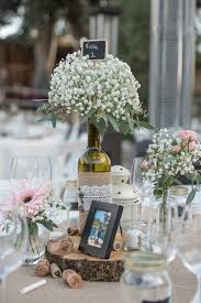 No two pieces are exactly alike. Wine Bottle Centerpieces With Baby S Breath