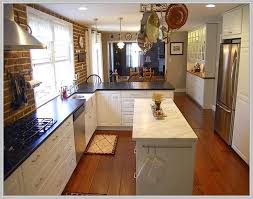 This geometric floor design personalizes the long, narrow galley kitchen. Long Narrow Kitchen Island Table Narrow Kitchen Island Kitchen Design Small Kitchen Remodel Small