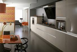 Glass mullion kitchen cabinet doors mixed with shaker cabinetry, frame a kitchen wall shared with a window over a sink. 15 Earth Toned High Gloss Kitchen Designs Home Design Lover