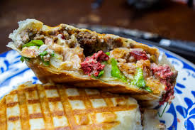 The tortilla is then folded around the filling and eaten by hand. Haute Cocina French Tacos Of Lyons Sandwich Tribunal