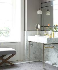 Brass adds instant warmth to a minimal scheme, offersthe perfect contrast for concrete bathrooms and gives an elegant edge to classic marble bathrooms; Marble And Brass Washstand Contemporary Bathroom Lonny Magazine