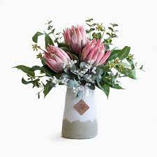 Pink Protea Eucalyptus And Tetra Nuts In Milk Vase Australian Native Flowers Artificial Flowers Wedding Artificial Flowers