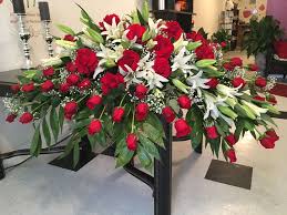 Funeral flowers by sue understanding organising a funeral is a very emotional and difficult time. Red Rose And White Lily Casket Spray Casket Flowers Funeral Floral Arrangements Casket Sprays