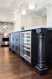 The design of kitchen islands is evolving fast to accommodate everything from wine fridges and seating to appliances, says amelia thorpe. Black Kitchen Island With Turned Legs And Microwave Transitional Kitchen Benjamin Moore White Heron