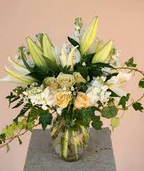 A Fantasy White Fairy Tale Casablanca Lilies White Or Ivory Roses And White Stock Complimente Fresh Flowers Arrangements Flower Arrangements Funeral Flowers