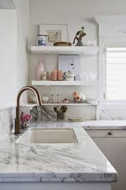 I wanted to retain my white cabinets so when it was time to renovate our kitchen countertops, i asked for a color that would complement my white cabinets, and this is what they. Caesarstone Frosty Carrina With Grey Cabinets