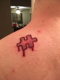 Saw Jigsaw Piece Tattoo Jigsaw Tattoo Movie Tattoos Puzzle Tattoos