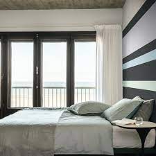 Wondering how to make one color stand out in a black and white photo? Black And White Bedroom Ideas With A Timeless Appeal
