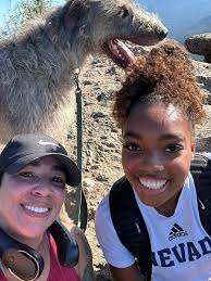 Mudi dog enjoying outdoor activities like camping and hiking