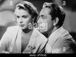 PAUL HENREID as Victor Laszlo INGRID BERGMAN as Ilsa Lund and JOHN QUALEN  as Berger in CASABLANCA 1942 director Michael CURTIZ Warner Bros Stock  Photo