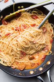 Spaghetti With A Cheesy Garlic And Tomato Sauce Flourishing Foodie Cherry Tomato Pasta Tomato Cream Pasta Tasty Pasta